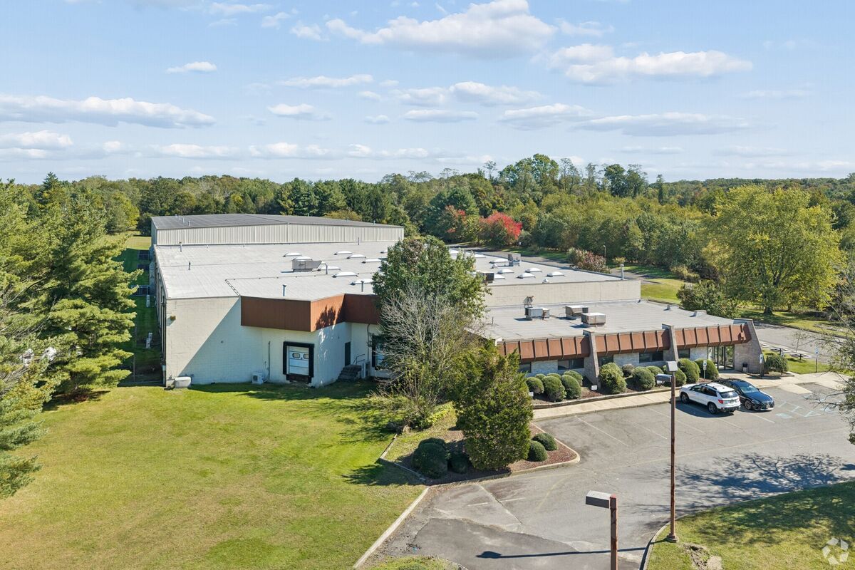 Drone view of the office front and the warehouse behind it